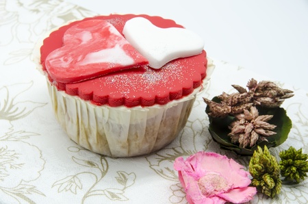 Gourmet cupcakes with hearts and decorationsの写真素材