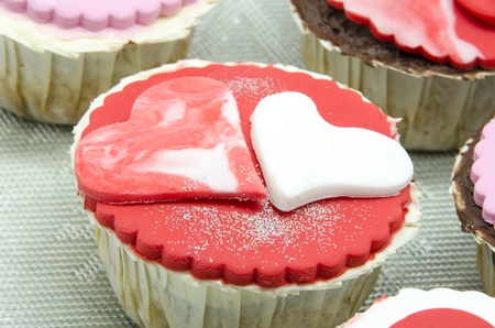 Gourmet cupcakes with hearts and decorationsの写真素材