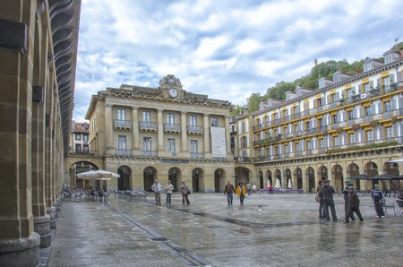 SAN SEBASTIAN, SPAIN - OCTOBER 16: unidentified tourists in Constitucion  Square on October 16, 2012 in San Sebastian, Spain.  The square was used as the arena for the first bull races in San Sebastian.   のeditorial素材