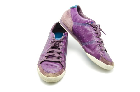 Purple shoes worn over white backgroundの写真素材
