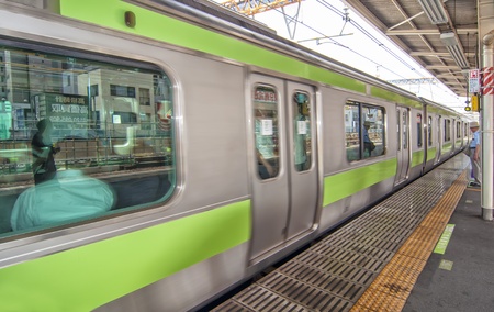 TOKYO,JAPAN-JULY 5:Yamanote line at Ueno train station on July 5,2011 in Tokyo,Japan. It is an urban line trian high in some parts of Tokyo´s most important and busiest city.のeditorial素材