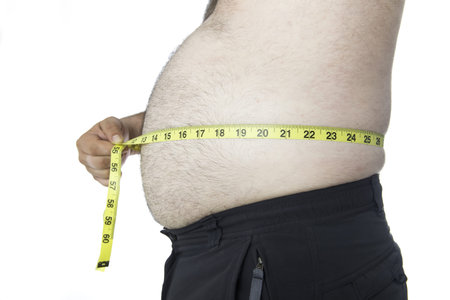 Fat man with a big belly with a tape measure