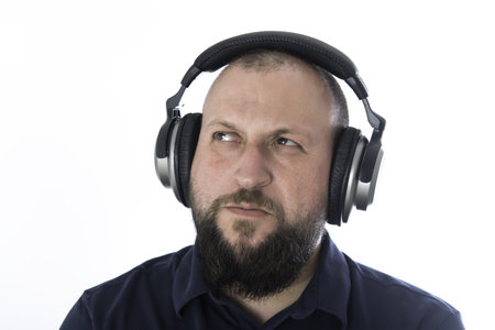 Man with helmets of music on white background