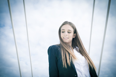 Business woman outdoor on a cloudy dayの写真素材