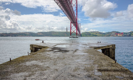 Bridge april 25, Lisbon, Portugal, on a cloudy dayの写真素材