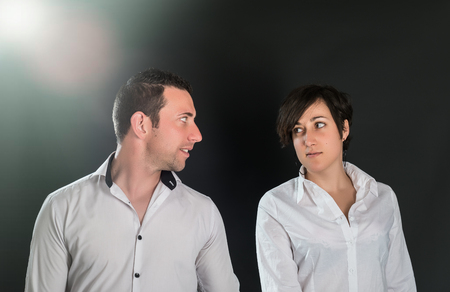 Young couple in love on black backgroundの写真素材