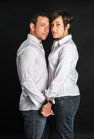 Young couple in love on black backgroundの写真素材