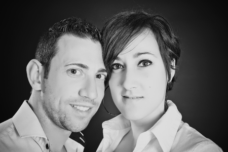 Young couple in love on black and whiteの写真素材