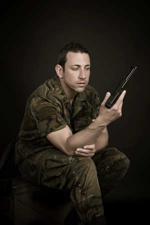 Spanish military with gun on black backgroundの写真素材