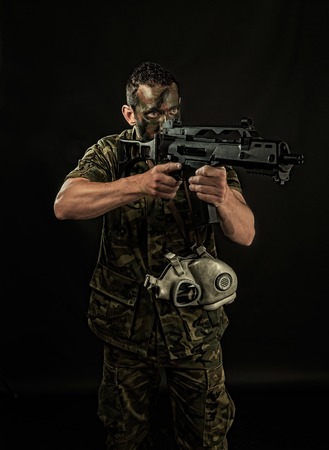 Spanish military with SMG on black backgroundの写真素材