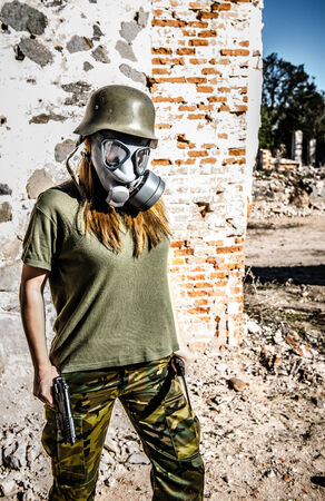 Military Girl walking with  gas maskの写真素材
