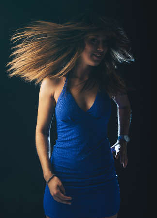 Beautiful young woman on a black backgroundの写真素材
