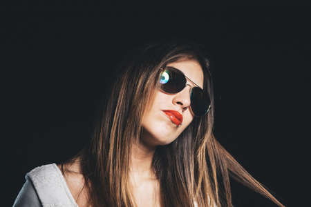 Beautiful young woman with sunglassesの写真素材