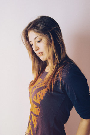 Beautiful young woman on a white background