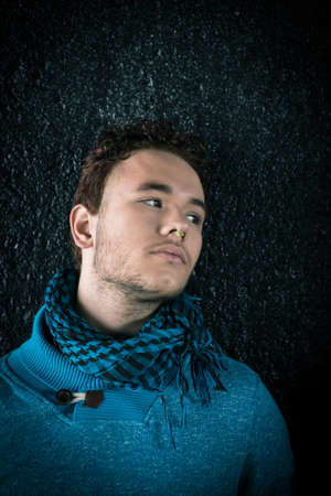 Portrait of young beautiful fashionable man in the streetの写真素材