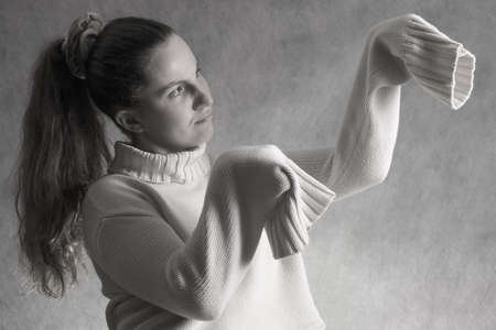 girl in wool sweater. mantis positionの写真素材