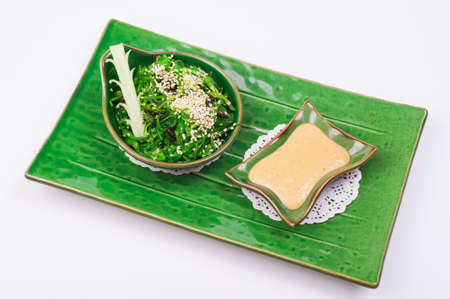 chuka salad with nut sause isolated on white backgroundの写真素材