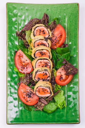 fried salmon roll on plate isolated on white backgroundの写真素材