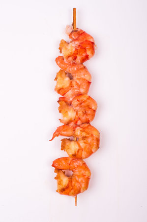 fried prawn skewer isolated on white backgroundの写真素材