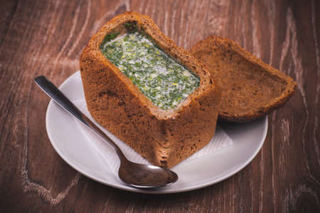 eastern european soup okroshka served in breadの写真素材
