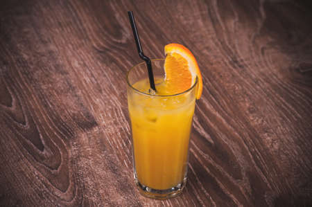 freshly squeezed orange juice in glass citrusの写真素材
