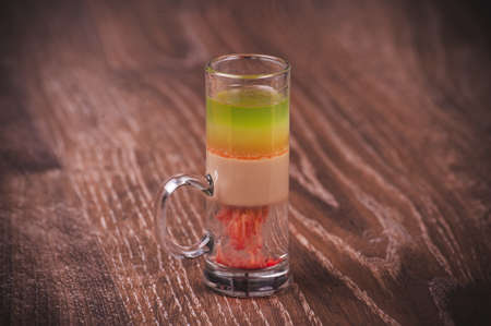 layered colorful shot cocktail with alcohol and vodkaの写真素材