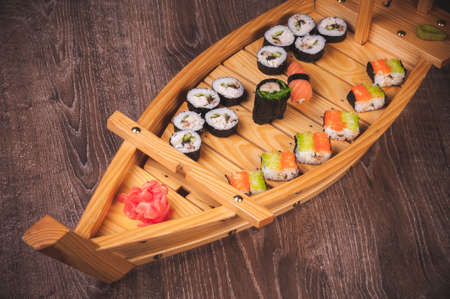 sushi roll, sashimi and nigiri boat setの写真素材