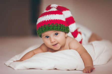 christmas baby girl newborn in new year hatの写真素材