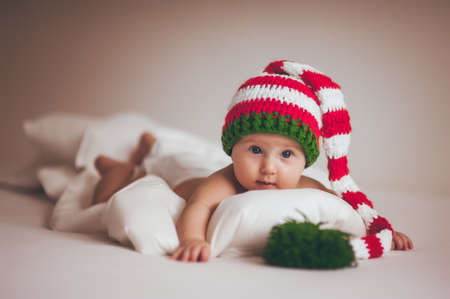 christmas baby girl newborn in new year hatの写真素材