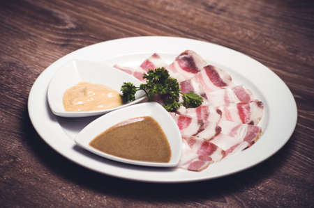 slised salo porc fat bacon with horseredishの写真素材