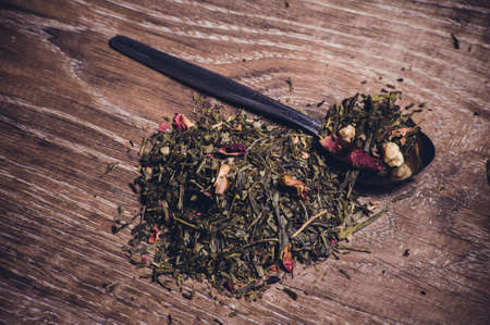 herbal tea with dried flowers on spoonの写真素材