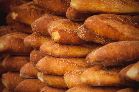 freshly baked bread stuck on top of each otherの写真素材