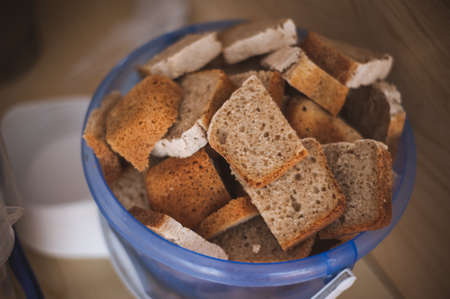 cut bread in  bucket for homeless people in ukraineの写真素材