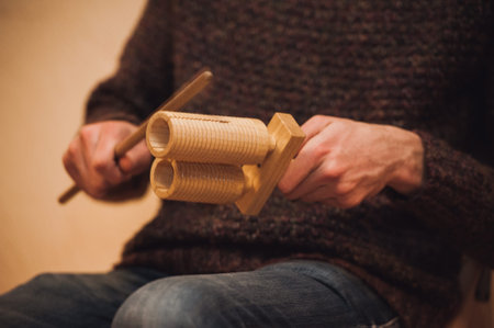 men playing wooden holz agogo no faceの写真素材