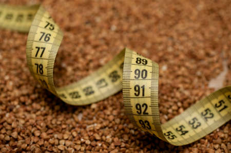 yellow centimeter tape on backwheat background texture 90 cmの写真素材