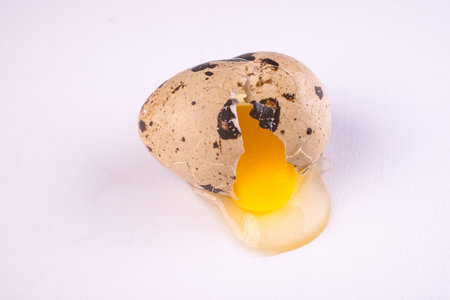 Broken Quail Egg isolated on white background