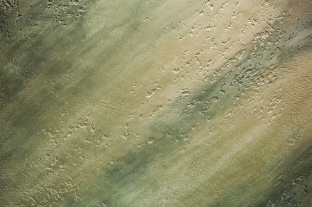 Background texture of green colored plaster walls.