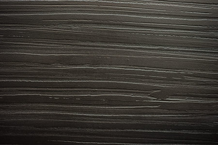 Background black textured plastered wall dark horizontal