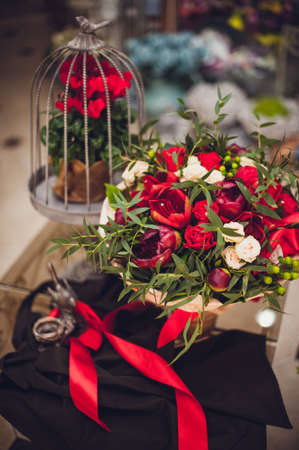 beautiful red and white mix flowers bouquet  on decorated tableの写真素材