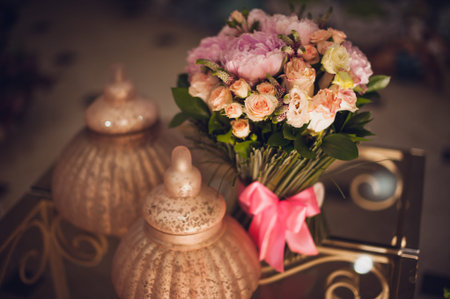 Bouquet of pink peonies  on table with decorの写真素材