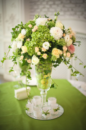 Beautiful flowers on table in wedding day. green apple themeの写真素材