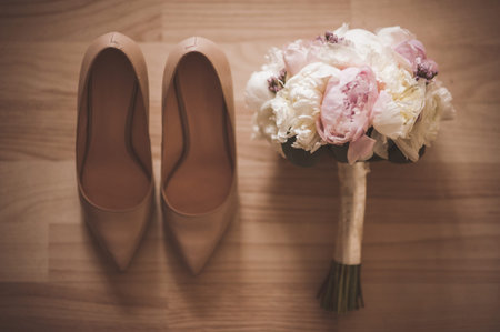 The beautiful bridal bouquet with wedding shoeの写真素材