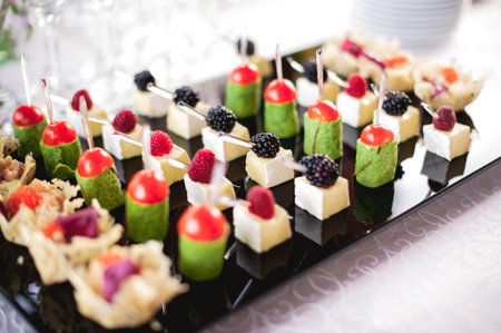 mixed fingerfood and canapes on appetizer table