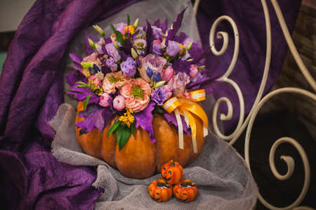 beautiful fall bouquet in a vase from pumpkinの写真素材