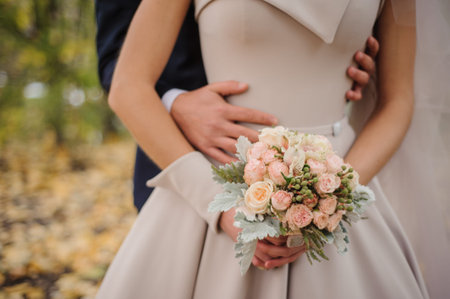 bride and groom holding bouquet no face