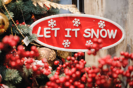 sign saying let it snow red and whiteの写真素材