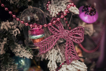 pink Bow christmas tree toy  on branchの写真素材
