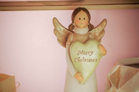 christmas angel toy decor on the shelfの写真素材