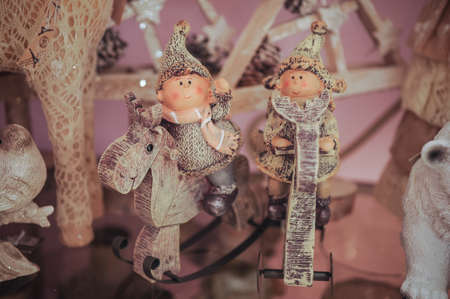 Couple of two children statue for christmas decoration. on sheelfの写真素材