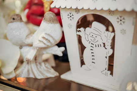 Wooden Christmas figurines snowmen on the shelfの写真素材